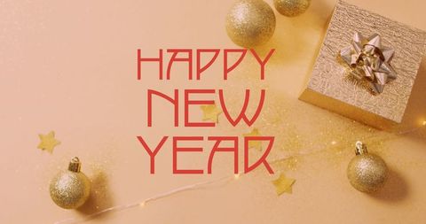 Luxury new year greeting with gold ornaments and gift box