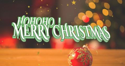 3d merry christmas typography with festive red bauble and golden bokeh lights