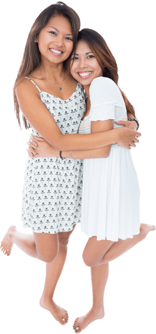 Cheerful Asian Sisters Sharing Warm Embrace with Transparent Background