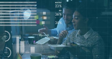 Business team analyzing financial data on transparent screens