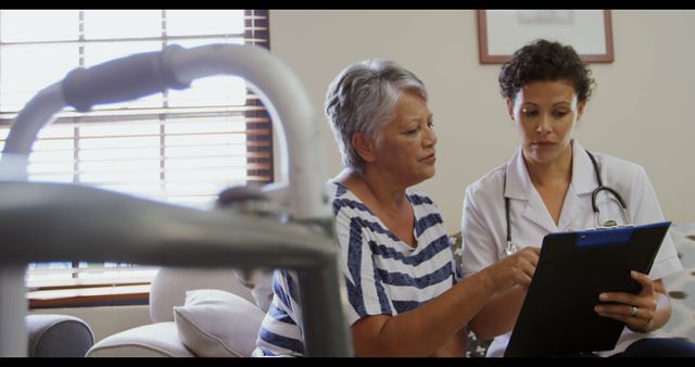 Senior Woman Consulting with Female Doctor at Home - Download Free Stock Images Pikwizard.com