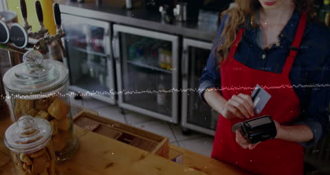 Waitress in Cafe Swiping Card with Digital Data Overlay
