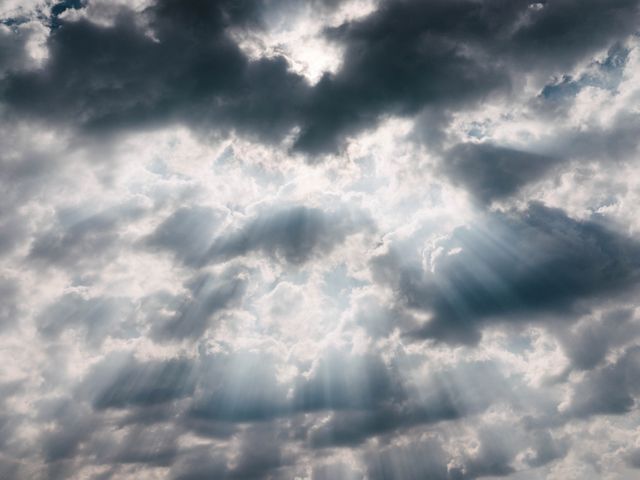 Dramatic Sun Rays Through Clouds on a Stormy Day - Download Free Stock Photos Pikwizard.com