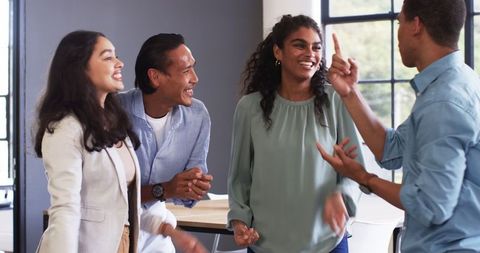Happy Multiracial Office Colleagues Celebrating Together