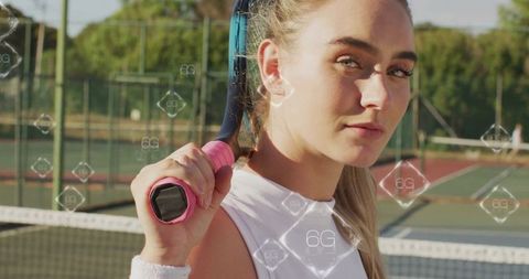 Athlete Holding Racket on Tennis Court with 6G Innovation Symbols