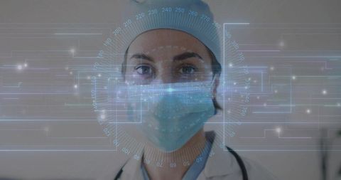 Female clinician wearing surgical mask and cap with augmented reality hud overlay