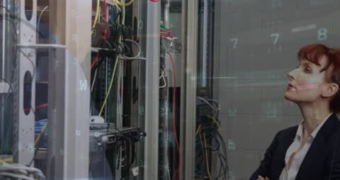 Businesswoman Analyzing Data in Server Room with Digital Overlay