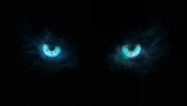 Glowing catlike eyes with mysterious teal mist