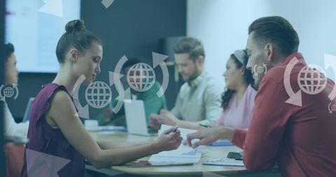 Diverse Business Team Discussing Global Solutions in Modern Office