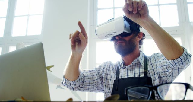 Man Using VR Headset for Design Work in Modern Office - Download Free Stock Images Pikwizard.com