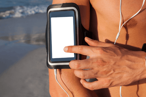 transparent workout armband on beach with mobile - Download Free Stock Videos Pikwizard.com