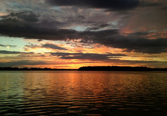 Serene Sunset Over Calm Lake with Dramatic Clouds and Reflections - Download Free Stock Photos Pikwizard.com