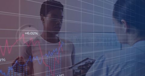 Diverse Professionals Analyzing Stock Market Trends on Digital Interface