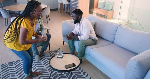 Couple consulting professional at home discussing future plans