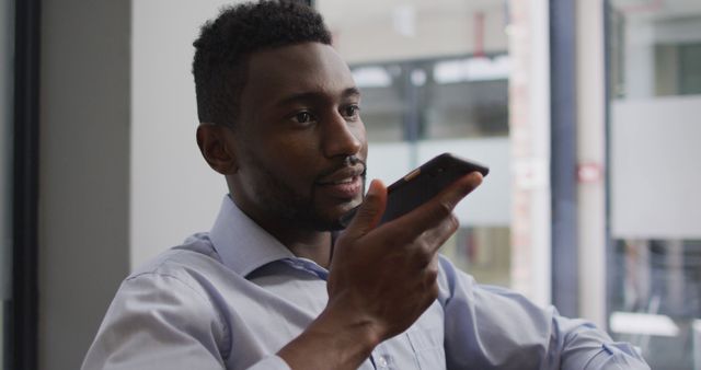 Businessman Using Voice Command on Smartphone in Office - Download Free Stock Images Pikwizard.com