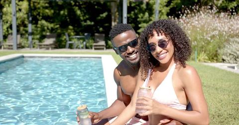 Cheerful African American Couple Enjoying Sunny Day by Pool - Download Free Stock Images Pikwizard.com