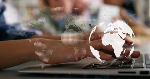 Typing hands connecting global network on laptop keyboard with digital world map overlay