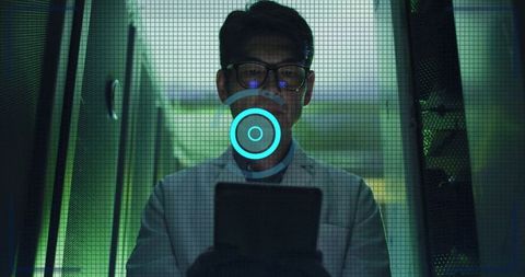 Korean IT Technician Monitoring Server Racks with Tablet and Futuristic HUD
