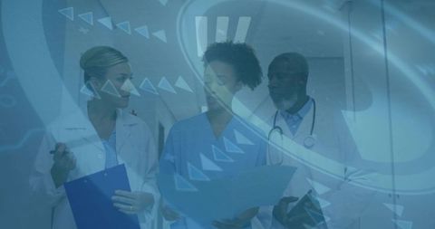 Diverse Healthcare Team Analyzing Patient Data in Hospital Corridor