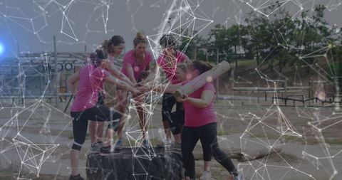 Women Collaborating on Obstacle Course with Digital Overlay