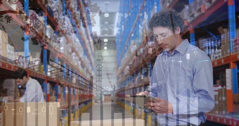Warehouse manager holding tablet checking inventory analytics, barcode charts and boxes