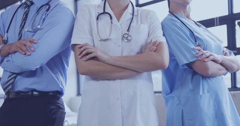 Confident Medical Professionals with Arms Crossed in Hospital - Download Free Stock Images Pikwizard.com