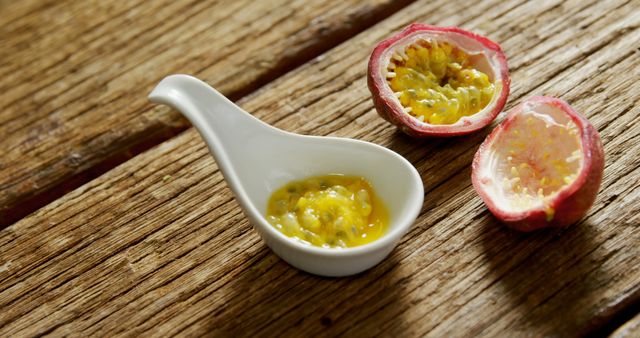 Fresh Passion Fruit Pulp in White Ceramic Spoon on Wooden Table - Download Free Stock Images Pikwizard.com