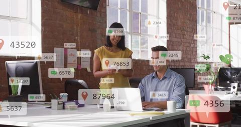 Colleagues collaborating in modern loft office with digital notifications and data overlays