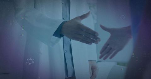 Clinician Offering Handshake to Patient with Digital Healthcare Overlay