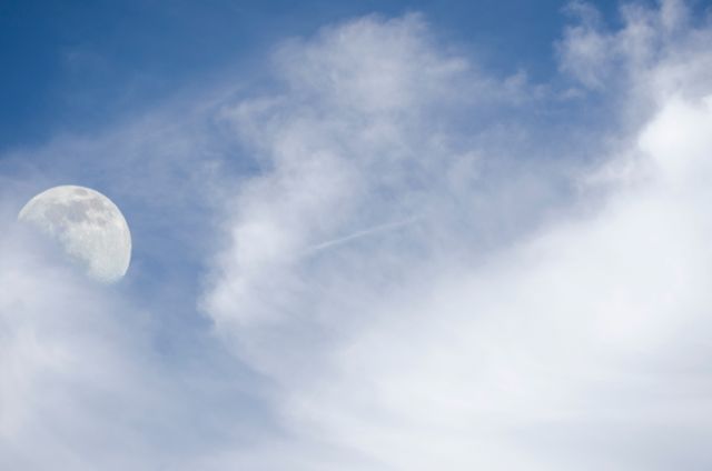 Daytime Moon with Wispy Clouds in Blue Sky - Download Free Stock Photos Pikwizard.com