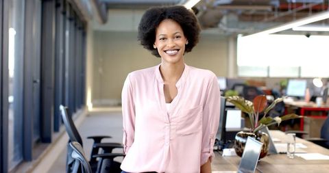 Confident Businesswoman in Modern Office Workspace