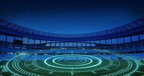 Digital interface scanning over modern sports stadium at night