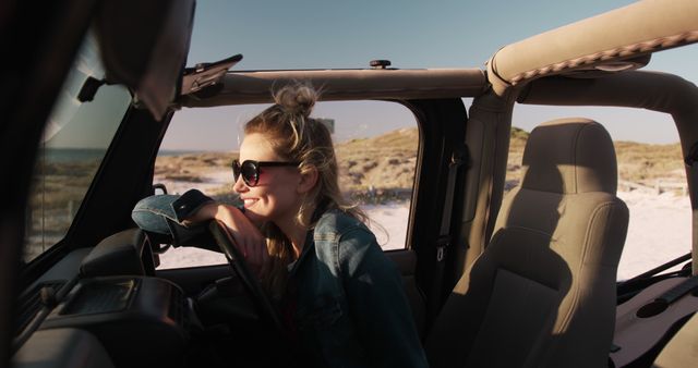 Woman Enjoying Coastal Road Trip in Convertible Jeep During Sunset - Download Free Stock Images Pikwizard.com