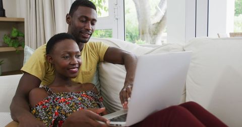 Joyous African American Couple Relaxing with Laptop - Download Free Stock Images Pikwizard.com