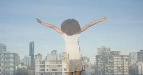 Empowerment and Freedom amidst Urban Cityscape - Download Free Stock Images Pikwizard.com