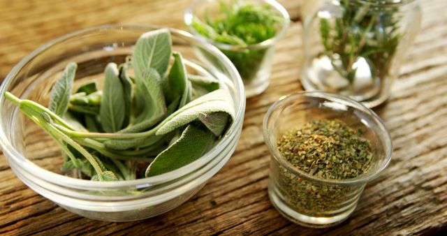 Various Fresh and Dried Herbs in Glass Bowls on Wooden Table - Download Free Stock Images Pikwizard.com