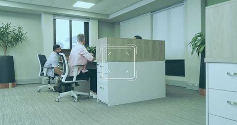 Modern office workspace with team collaboration and indoor plants