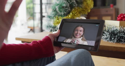 Christmas Video Call with Smiling Woman on Tablet