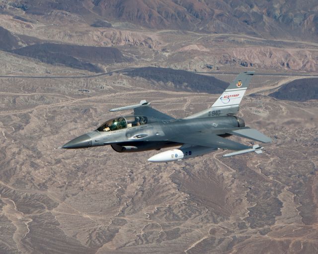 US Air Force F-16D Jet in Flight Over Desert Landscape - Download Free Stock Photos Pikwizard.com