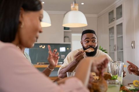 Friends Sharing Meal in Modern Kitchen Gathering