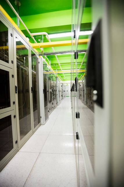 Hallway with a row of servers in server room