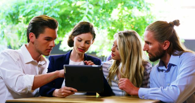 Team Collaborating with Tablet in Outdoor Workspace - Download Free Stock Images Pikwizard.com