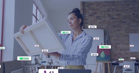 Artist Contemplating Blank Canvas Surrounded by Social Media Icons