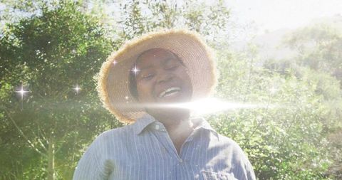 Woman Enjoying Sunny Day in Garden with Radiant Smile