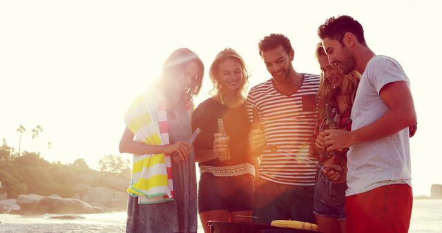 Friends Enjoying Sunset Beach Barbecue - Download Free Stock Images Pikwizard.com