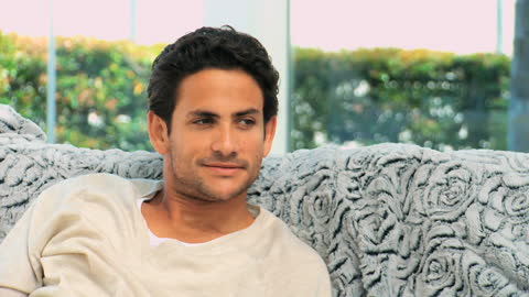 Man Relaxing on Couch in Cozy Home Environment