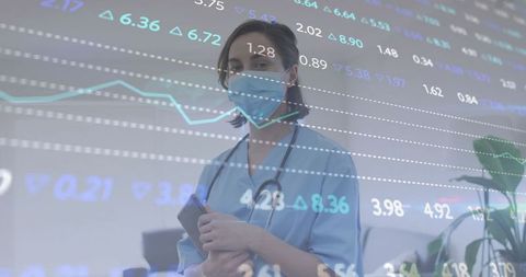 Healthcare Professional Analyzing Market Trends Overlayed with Graphs