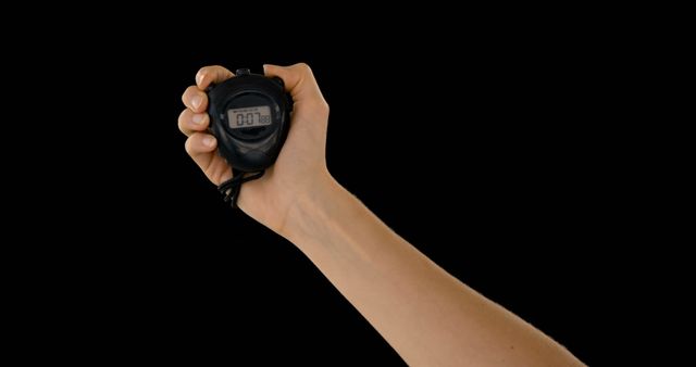 Hand Holding Stopwatch on Black Background Measuring Time - Download Free Stock Images Pikwizard.com