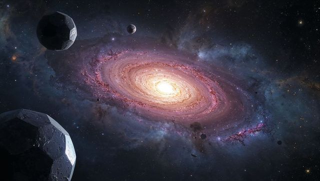 Vibrant spiral galaxy surrounded by drifting asteroids in deep space