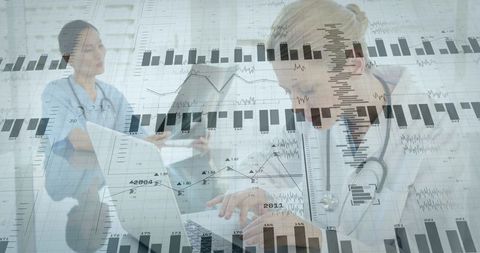 Medical Professionals Analyzing Graphs with Technology in Clinic